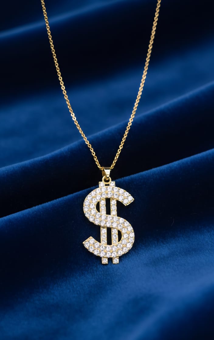 Gold tone diamond dollar sign pendant